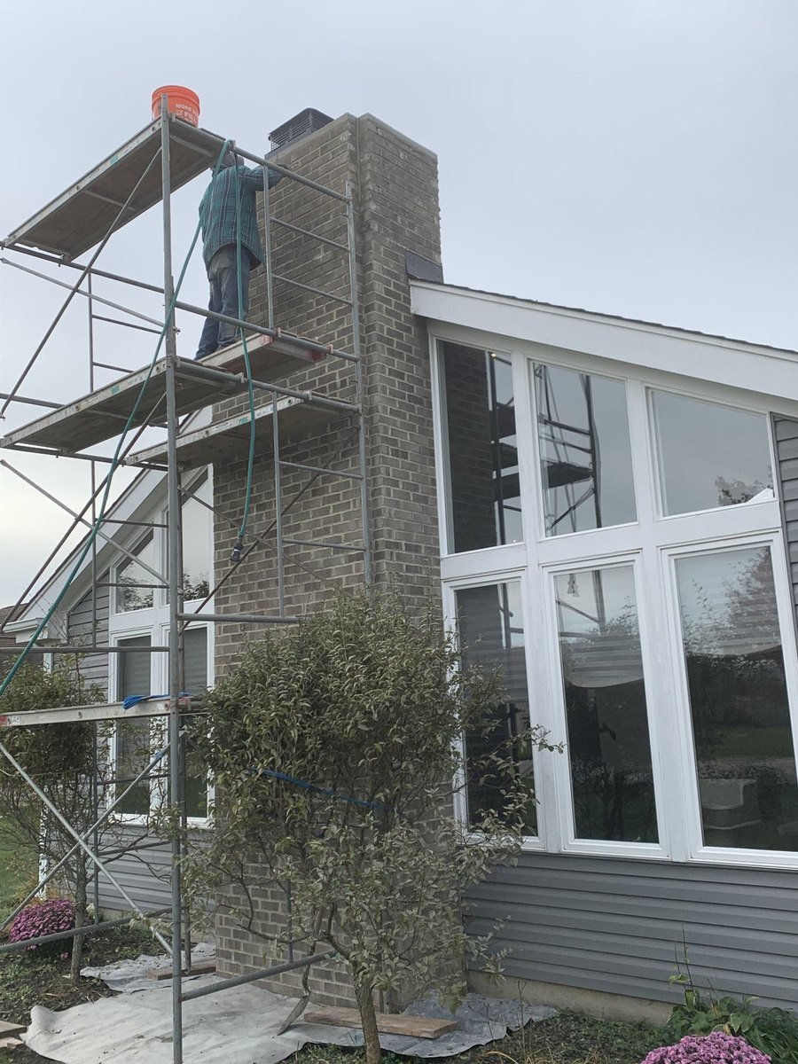 Scaffolding set up for a full chimney and wall restoration