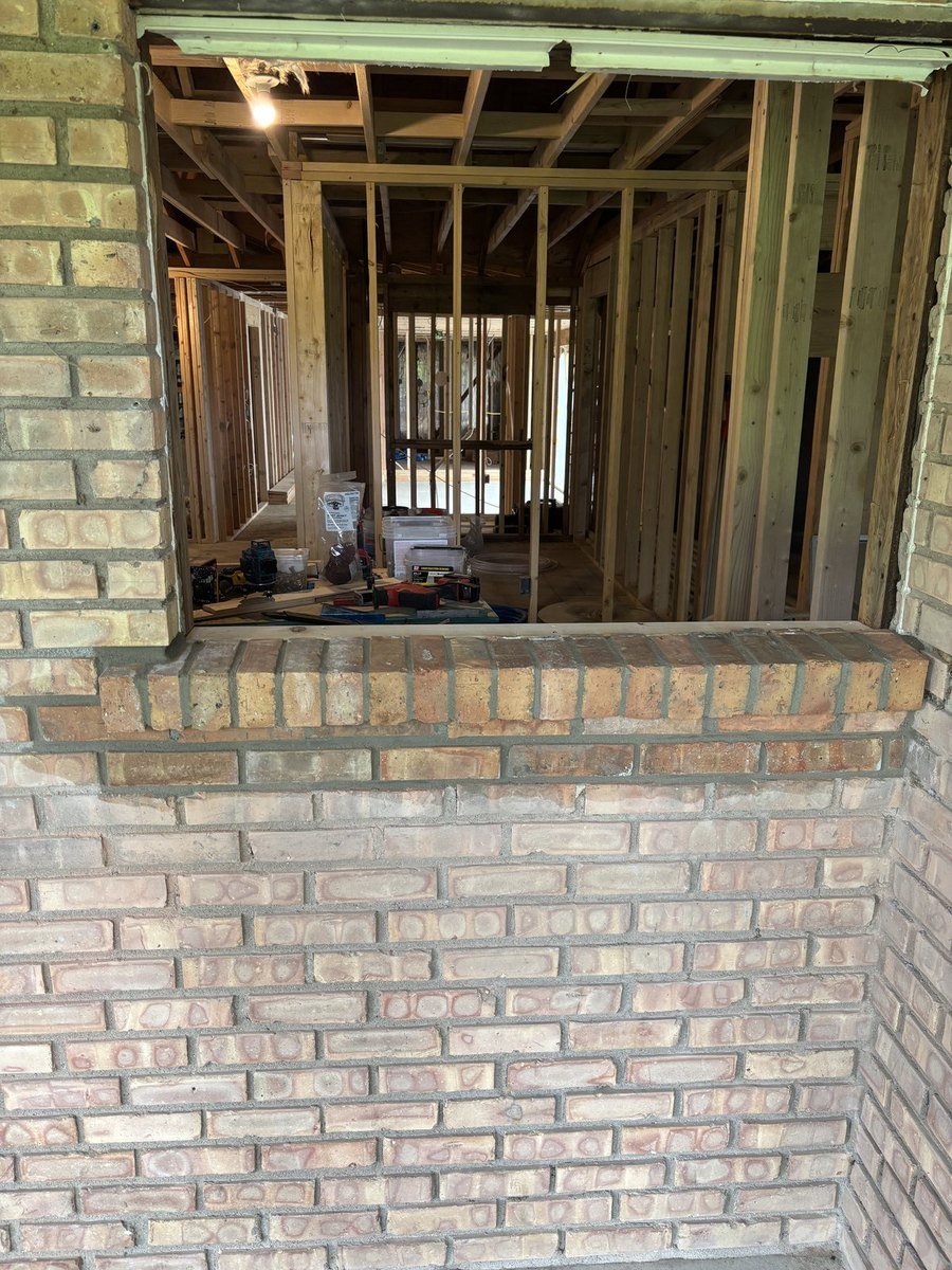 Brick wall rebuilt to resize a window opening
