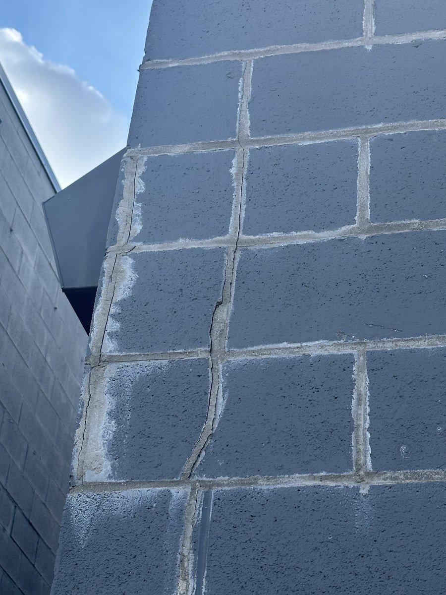 Stair-step crack in block wall before repair