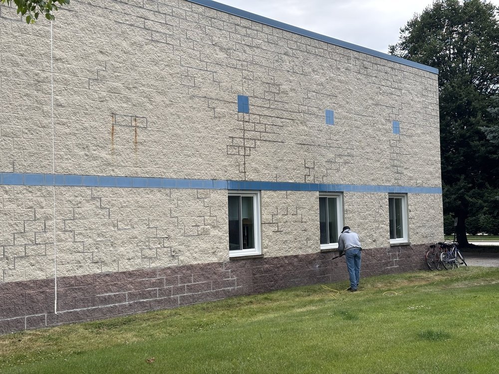 Building wall after tuckpointing, before coating