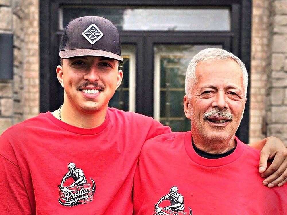 Pete Prestia and his son Collin outside a project