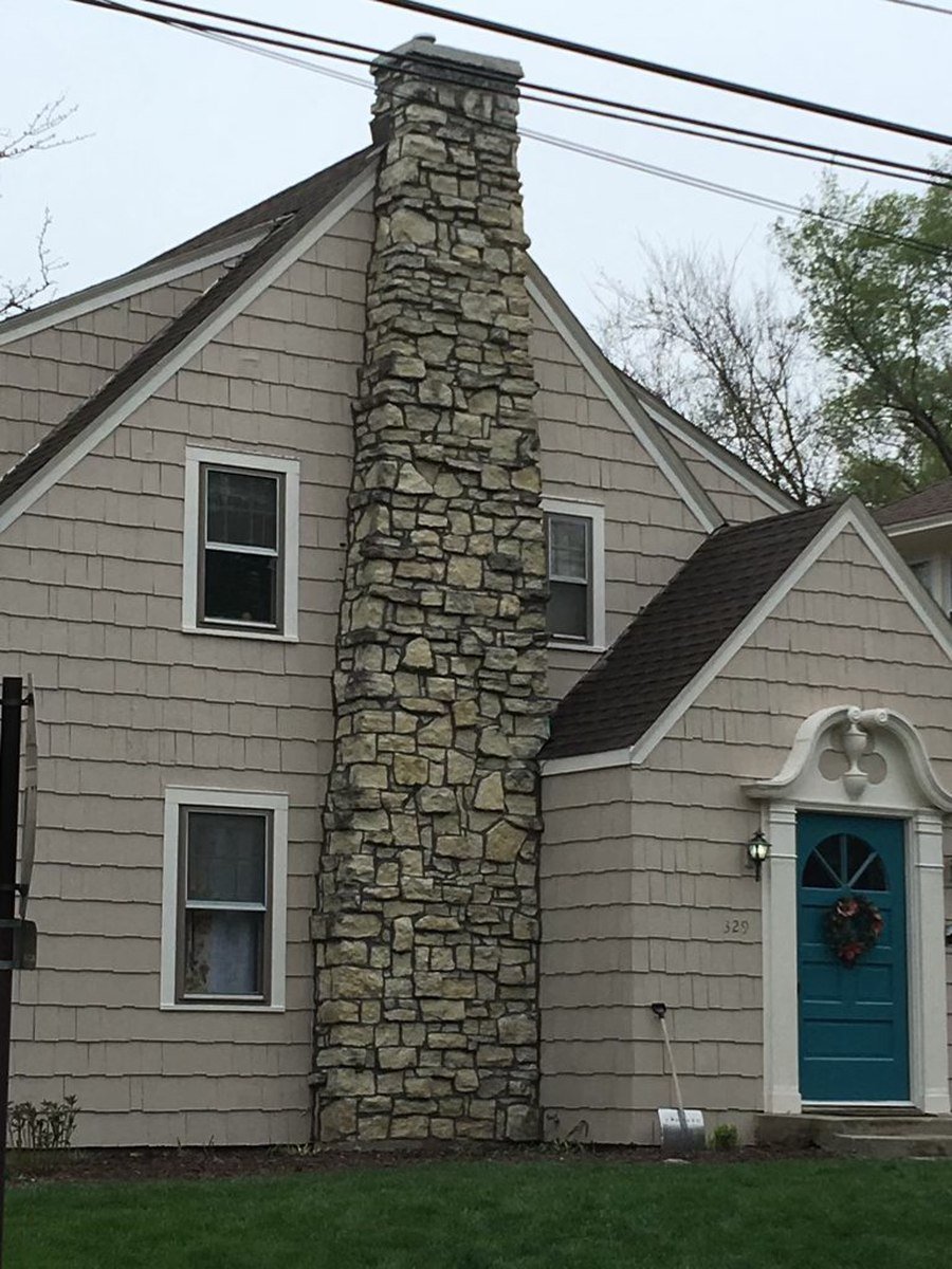 Stone chimney after repointing, joints clean and uniform