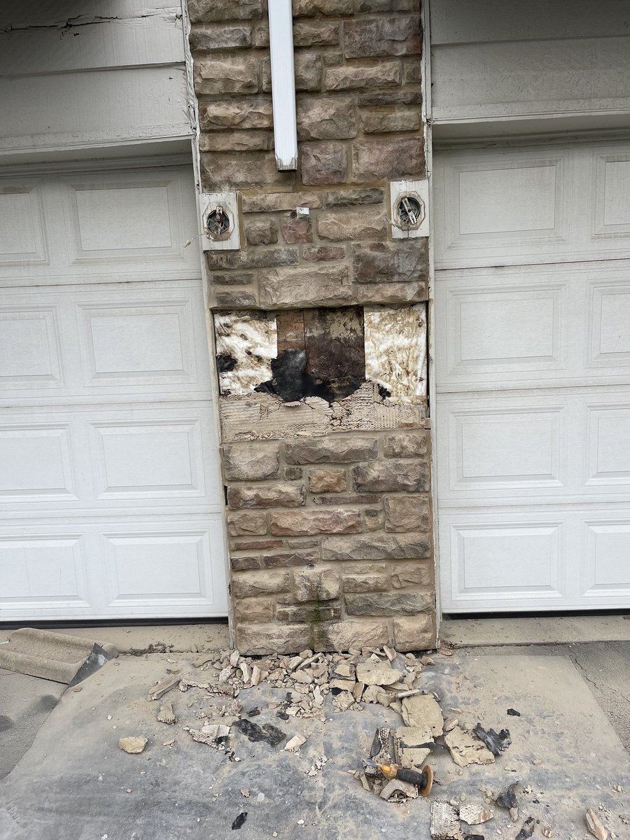Stone column with missing and broken stone before rebuild