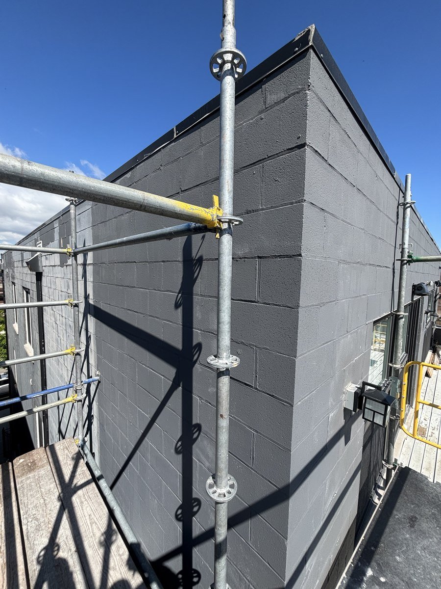 Rebuilt and painted block wall after repair