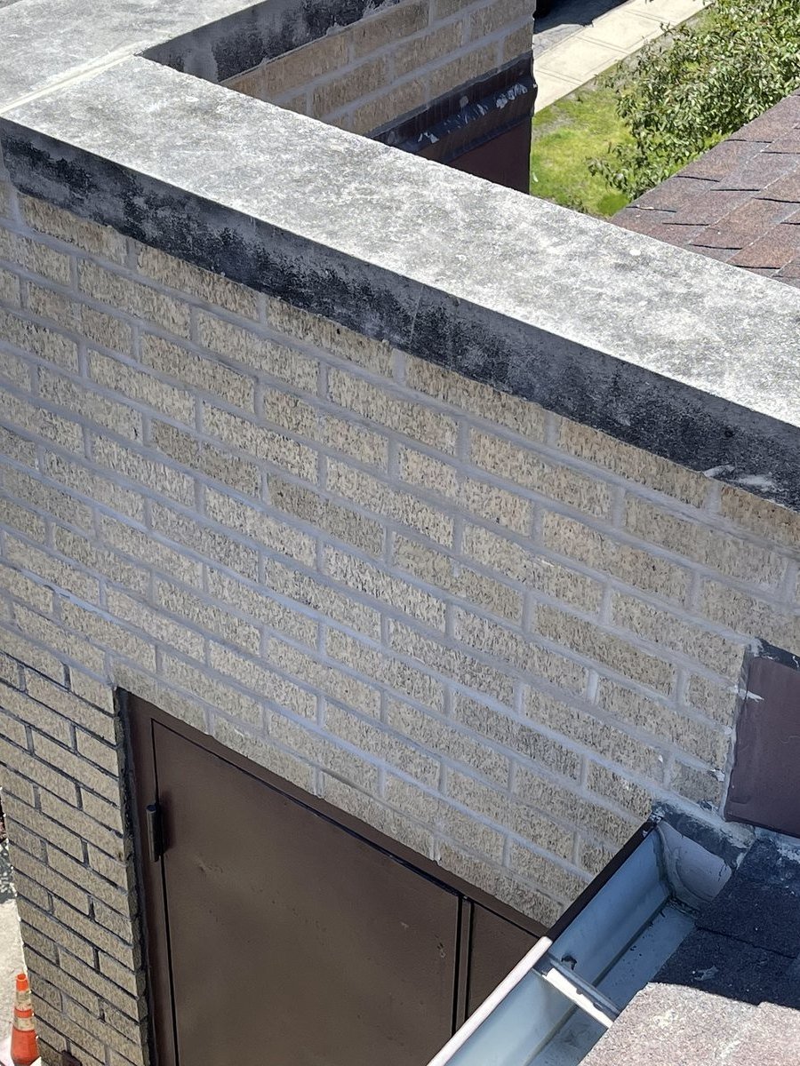 Wall cap before tuckpointing, stained and deteriorated joints