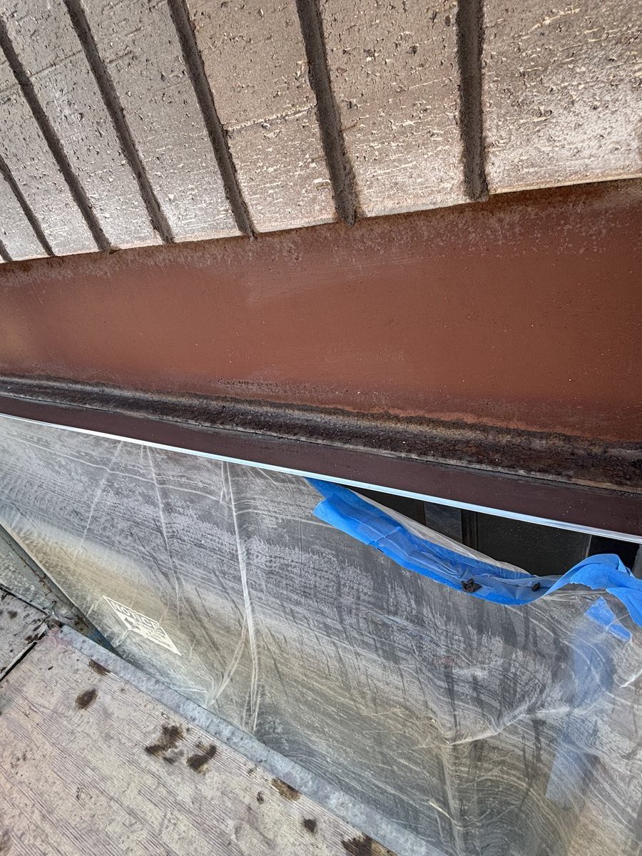 Steel lintel and flashing installed to manage water at a masonry opening