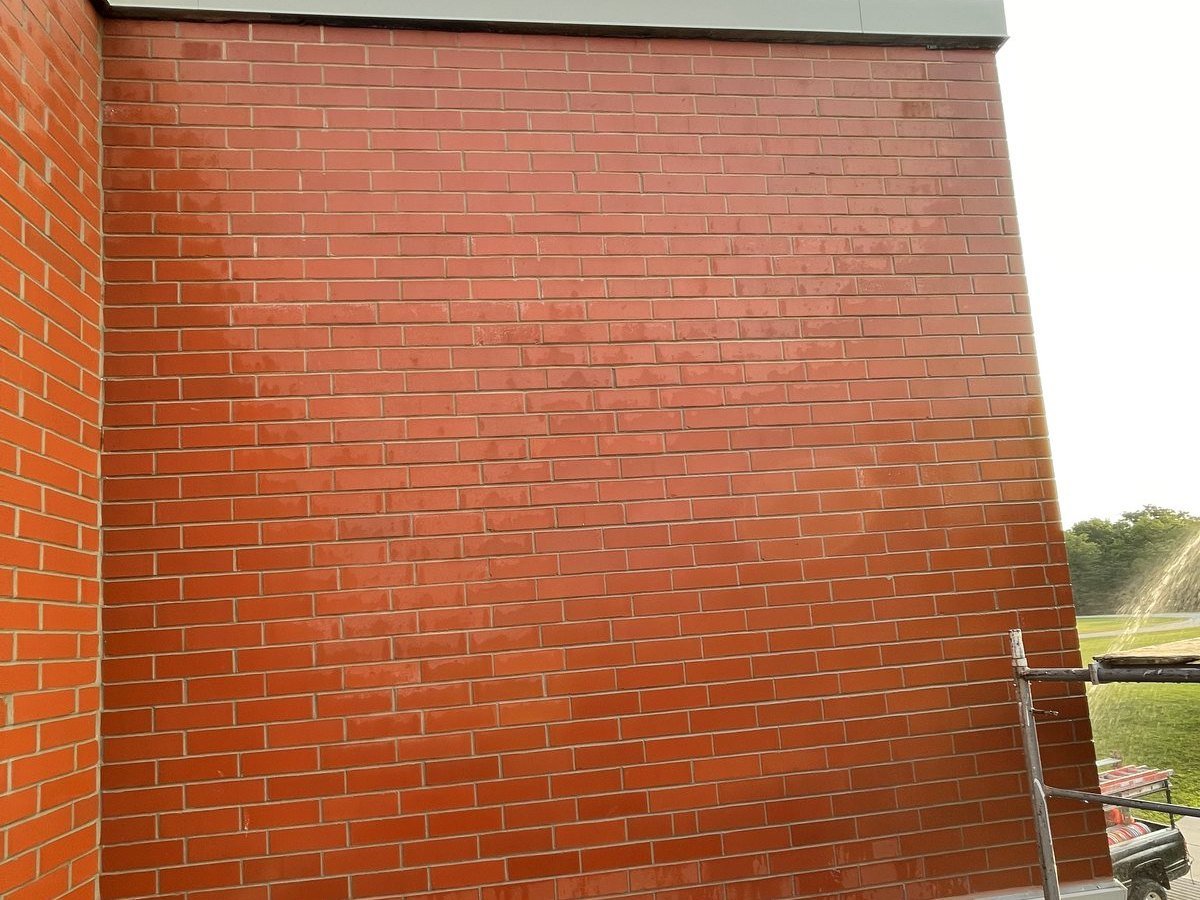 Masonry waterproofing and sealing at a roof and wall junction